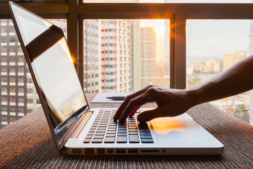 Person typing on computer